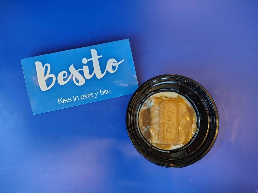 Lotus Biscoff milk cake in a black tub